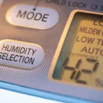 Air Purifier and dehumidifier. Concept for dehumidifying room. Humidity selection button. Humidity percentage display. Close-up device.